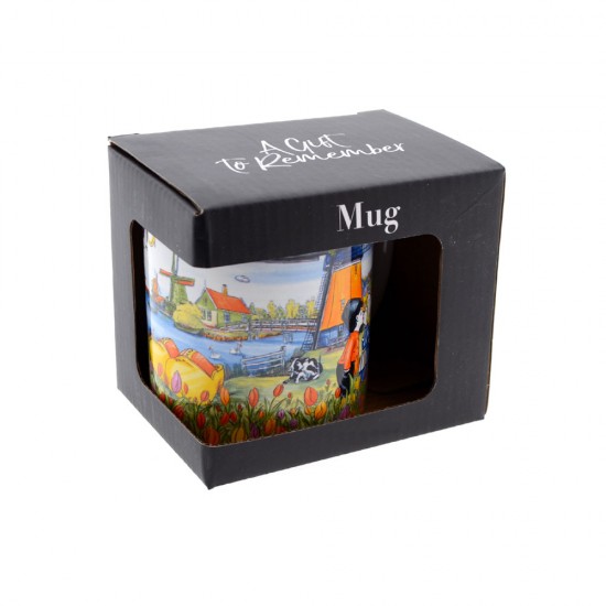 Ceramic cup and spoon set beautifully decorated in color with typical Dutch scenes such as windmills, tulips, clogs, cows, a bicycle and a couple in love.
