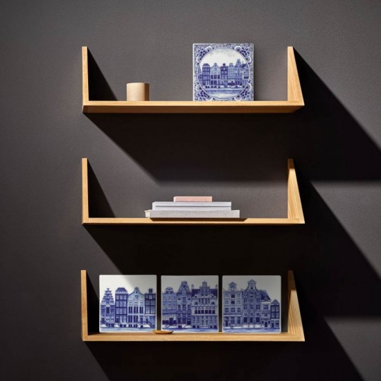 Tile with a Delft blue decoration of canal houses bordered with Delft floral decoration. A beautiful sturdy tile made of Delft blue earthenware.