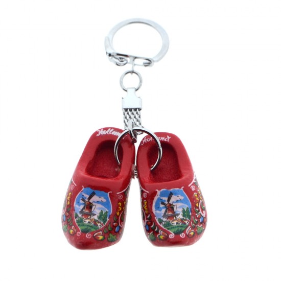 Schlüsselanhänger mit roten Holzschuhen (4 cm). Die Schuhe sind mit Blumen, einer Windmühle in einer typisch niederländischen Landschaft und dem Text „Holland“ verziert. Ideal für Schlüssel, Taschen oder als dekoratives Accessoire.