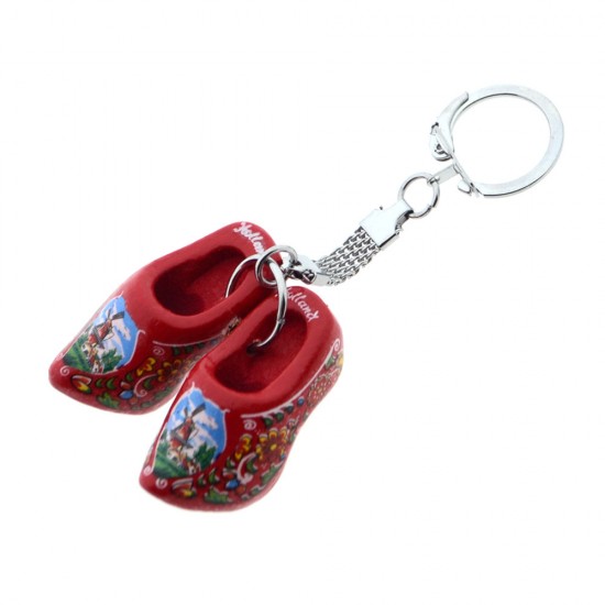 Schlüsselanhänger mit roten Holzschuhen (4 cm). Die Schuhe sind mit Blumen, einer Windmühle in einer typisch niederländischen Landschaft und dem Text „Holland“ verziert. Ideal für Schlüssel, Taschen oder als dekoratives Accessoire.
