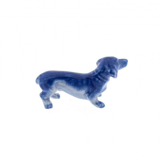 Hand-painted miniature statue of a dachshund made of Delft blue ceramics.
