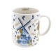 Ceramic mug decorated with a village mill and small tulips and the text Amsterdam in blue and gold tulips and the text Holland
