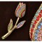 Broche tulp verguld strass kleur